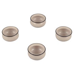Vintage Kähler. Four small ceramic bowls. Glaze in sandy tones with a black edge.