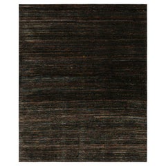 Rug & Kilim’s Oversized Textural Rug In Black with Bold Polychromatic Striae