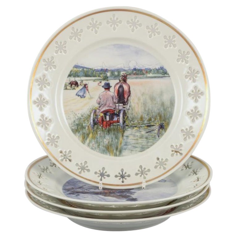 Bing & Grøndahl. Four porcelain plates with motifs from Carl Larssons paintings.