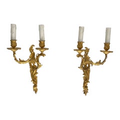 Coppia di sconsigliere in bronzo dorato in stile Luigi XV