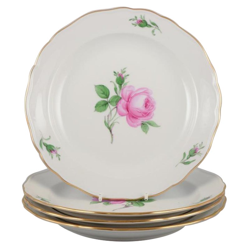Meissen, Germany. Four lunch plates with a motif of a pink rose.