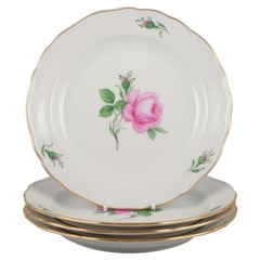 Meissen, Germany. Four lunch plates with a motif of a pink rose.