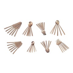 Scandinavian designer. Large and complete six-person dinner service in brass.