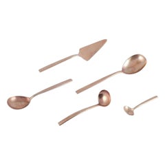 Scandinavian designer. Five serving pieces in hammered brass.