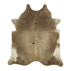 Rug & Kilim’s Extra Large Cowhide Rug in Beige-Brown and Cream Tones