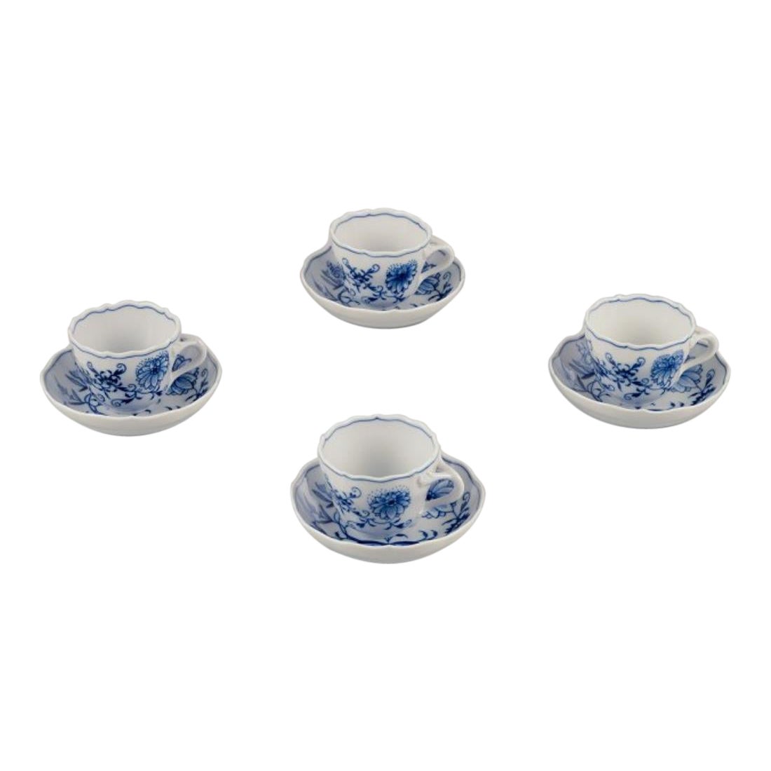 Meissen, Germany. Set of four Blue Onion demitasse cups with saucers.