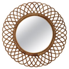 Miroir circulaire travaillé à la canne.