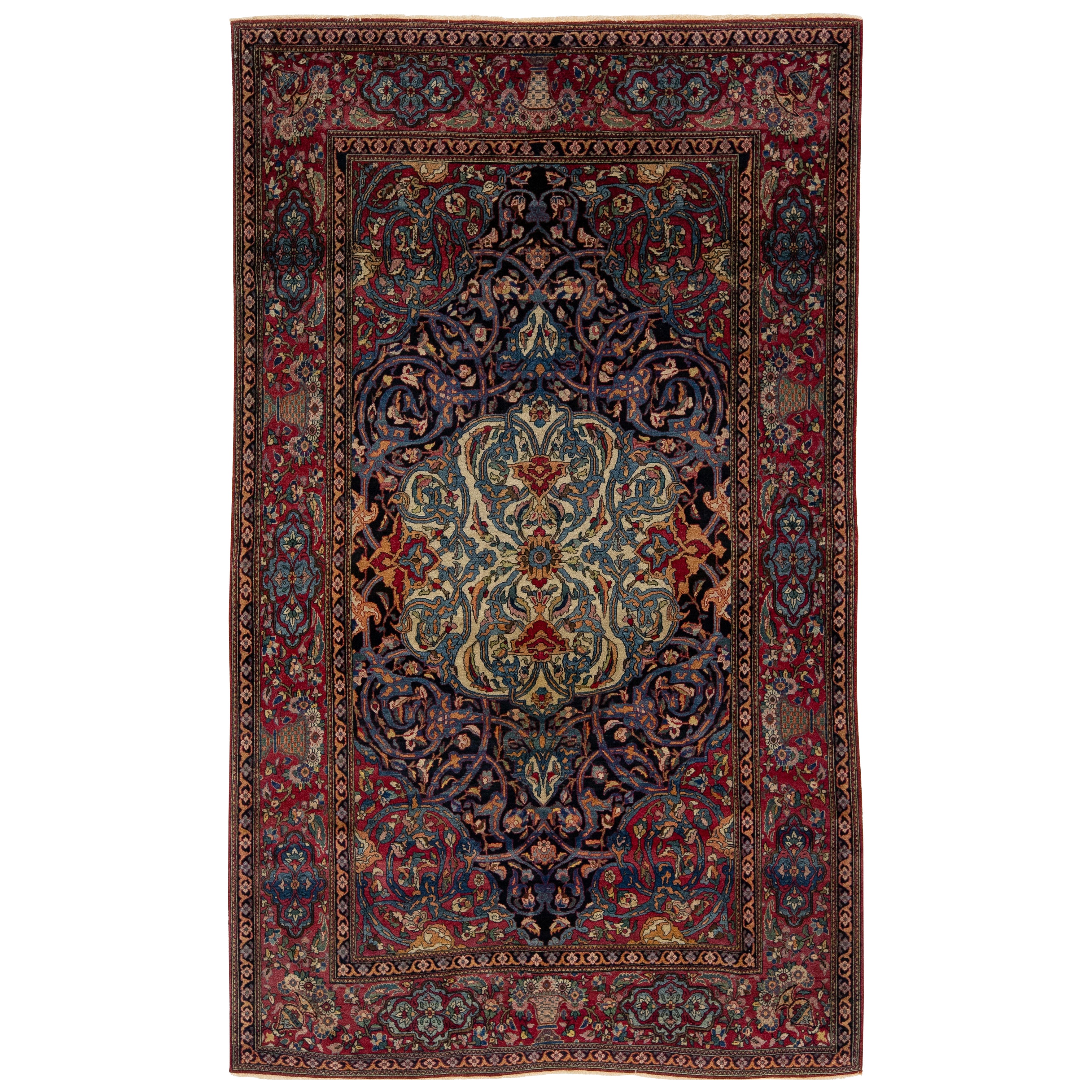 Antique Kerman Persian Navy Blue Wool Rug with a Rosette Motif