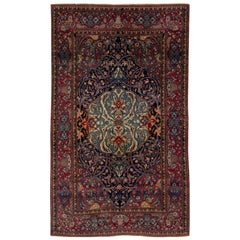 Antique Kerman Persian Navy Blue Wool Rug with a Rosette Motif