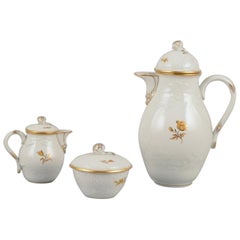 Meissen, Germany.  Porcelain coffee set: coffee pot, creamer, sugar bowl.