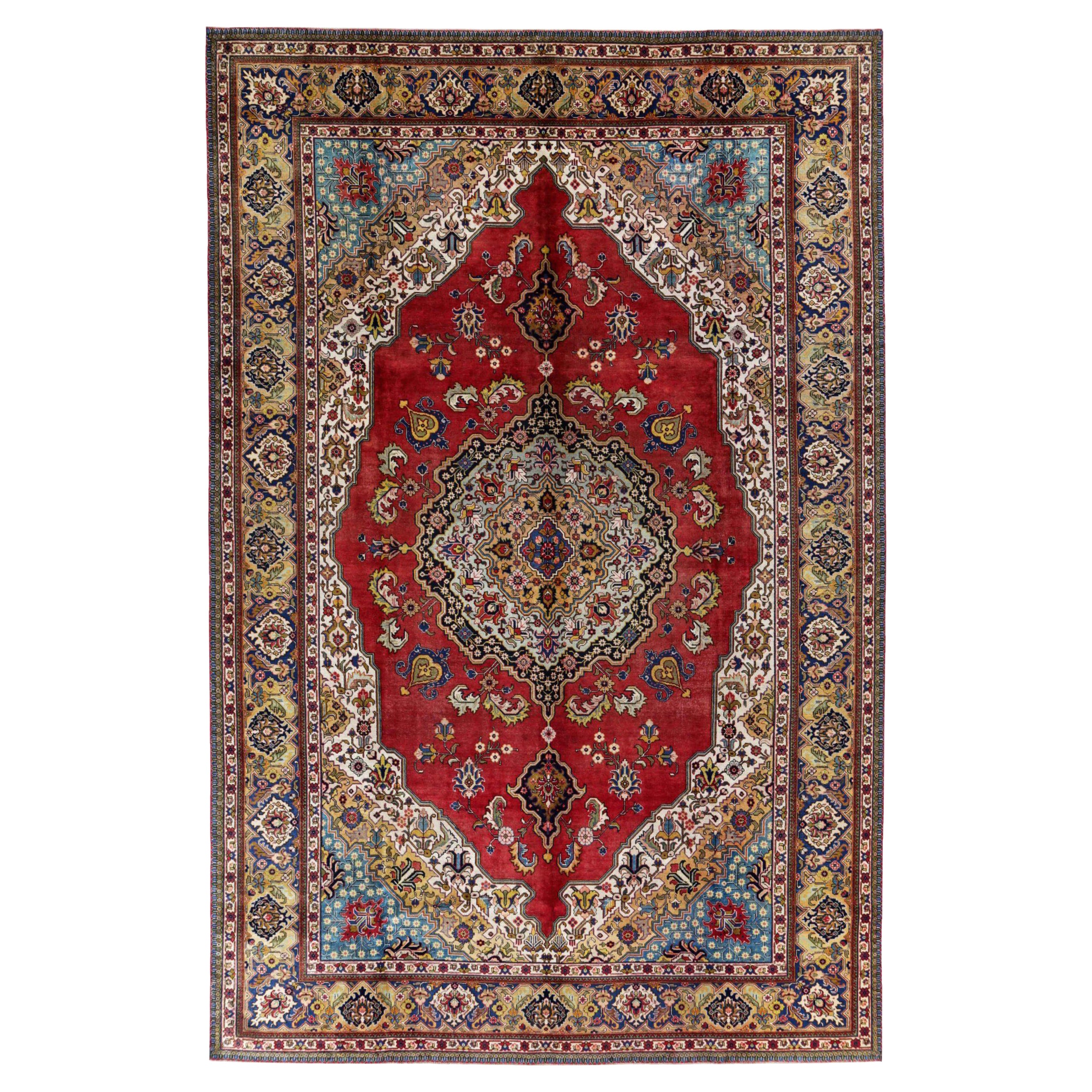 Tapis persans de Tabriz datant d'environ 1940, motif en laine bleu ivoire rouge jaune - 91436