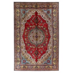 Tapis persans de Tabriz datant d'environ 1940, motif en laine bleu ivoire rouge jaune - 91436