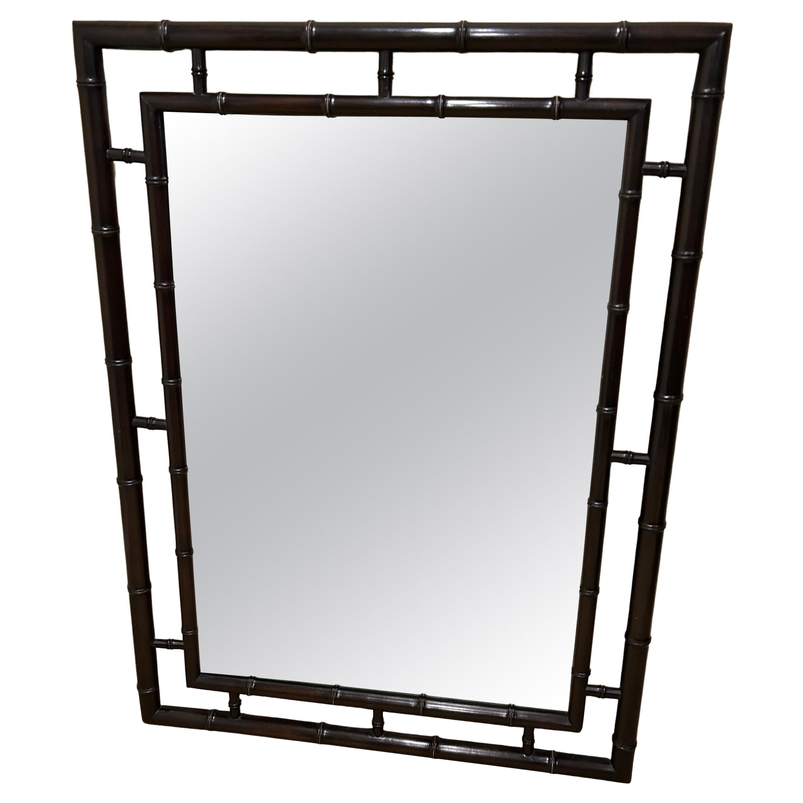 Grand miroir élégant en bois ébénisé et faux bambou de John Widdicomb en vente
