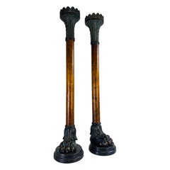 Candelabri oversize in bronzo e noce burlato del teatro Alexander