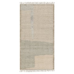 Tapis à motifs géométriques beige et gris de Rug & Kilim