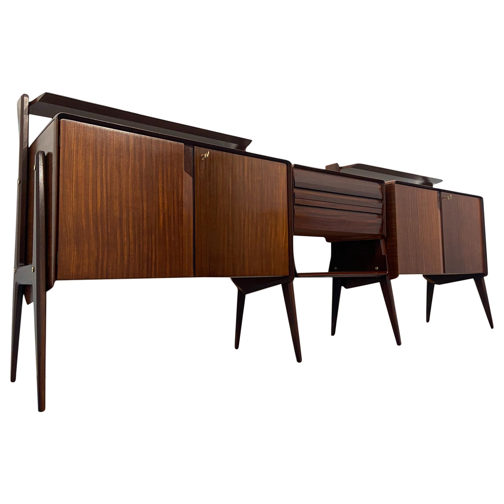 Amazing long and functional sideboard attributed to Ico e Luisa Parisi at the end of the 1950s for La Permanente Mobili Cantu', which combines an extremely modern design with a plenty of storage solutions ; this piece is in fact characterized by the