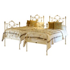 Matching Pair of Antique Cast Iron Antique Beds in Cream MP66