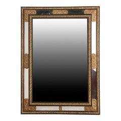 A Rare Large French Ebonized Wood and Brass Repousse Mirror, 19th C.