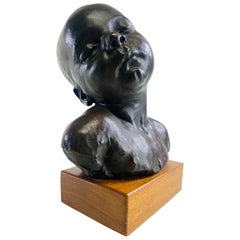 Mid-century vintage plaster sculpture of a young boy