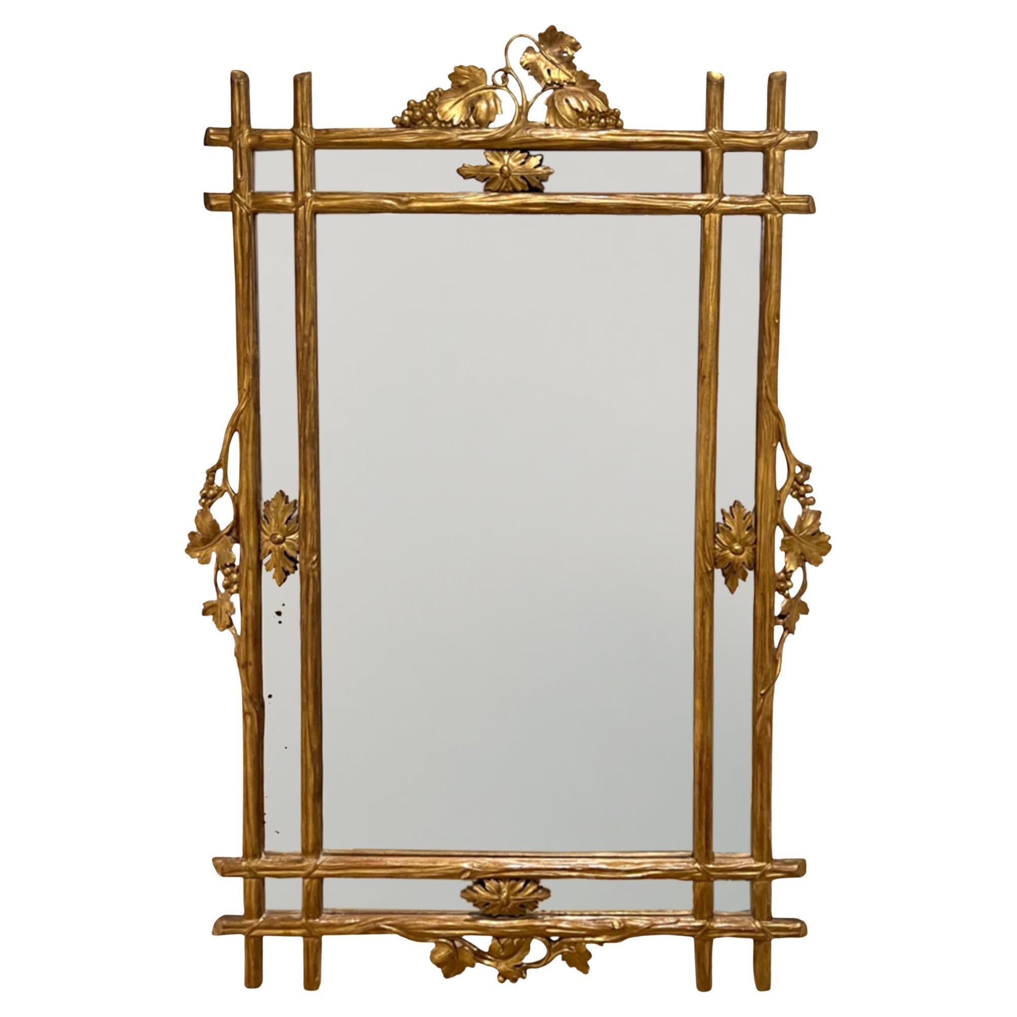 Specchio francese del XIX secolo in legno dorato con viti e uva