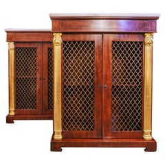 A fine pair of 19th century Regency mahogany and parcel gilt bookcases.