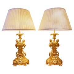 A fine pair of 19th century French gilt bronze cherub lamps