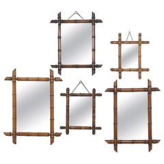 Cinq miroirs encadrés de bambou