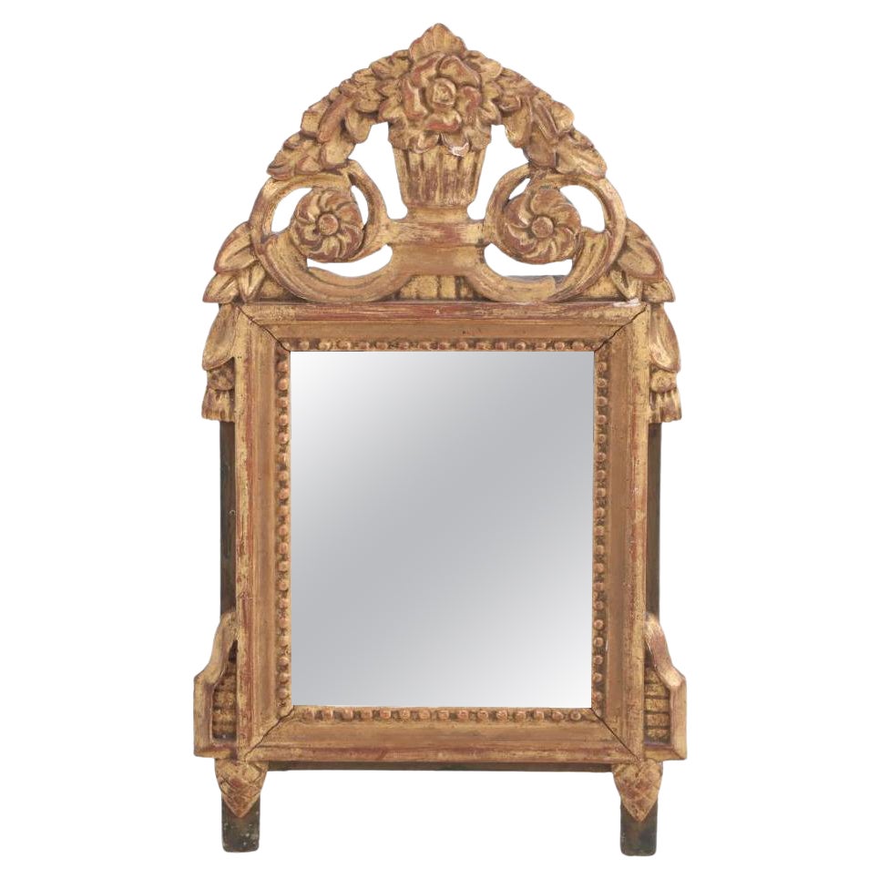 A French Louis XVI style carved and giltwood mirror, C 1810.