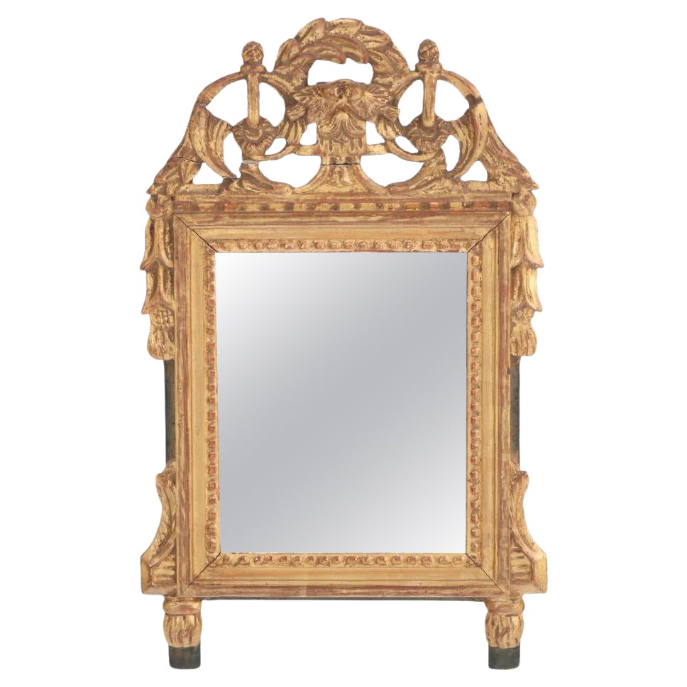 A French Louis XVI style carved and giltwood mirror, C 1810.