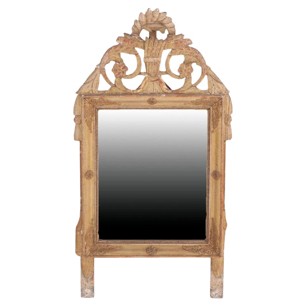 A French Louis XVI style carved and giltwood mirror, early 19th C.
