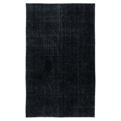 Tappeto per l'area di colore nero, annodato e tessuto a mano in Turchia