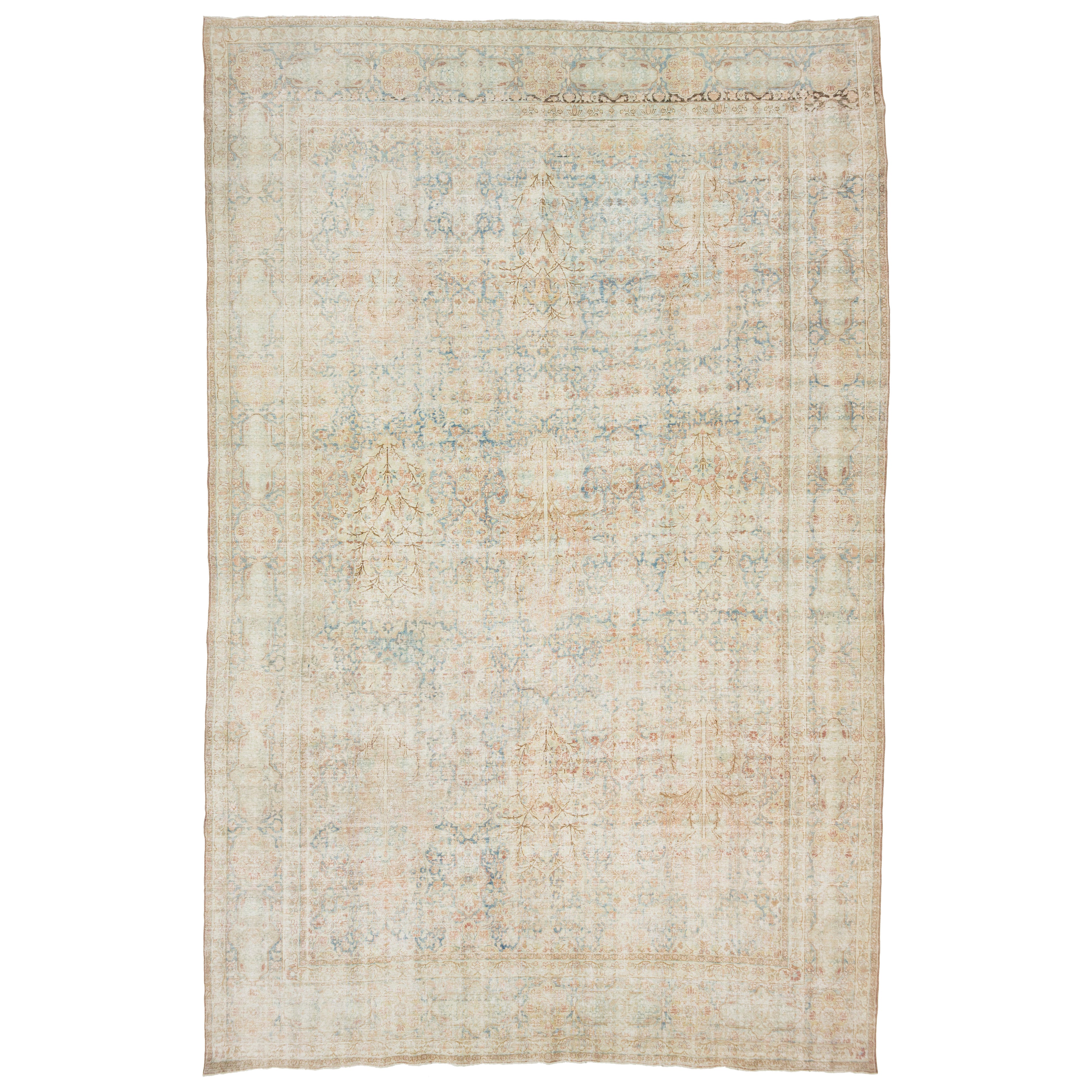 Tapis persan ancien de Tabriz en laine bleue avec motif sur toute la surface des années 1900