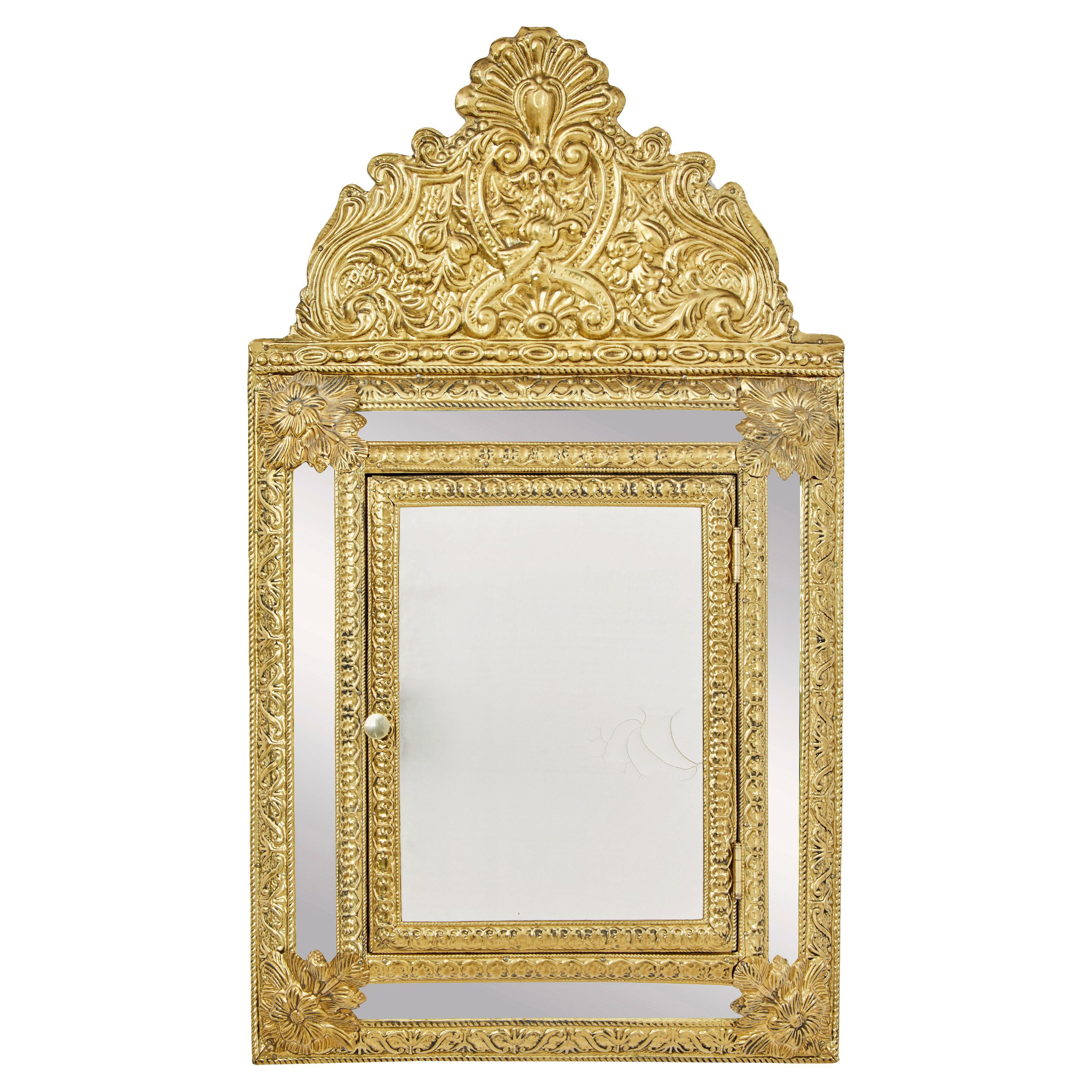 Mid 20th Century aesthetic movement inspired brass hall cushion mirror