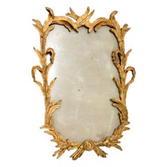 Miroir ancien en bois doré