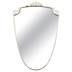 Mid Century Italian Oval Shield Shaped Mirror With Decorative Scrolls