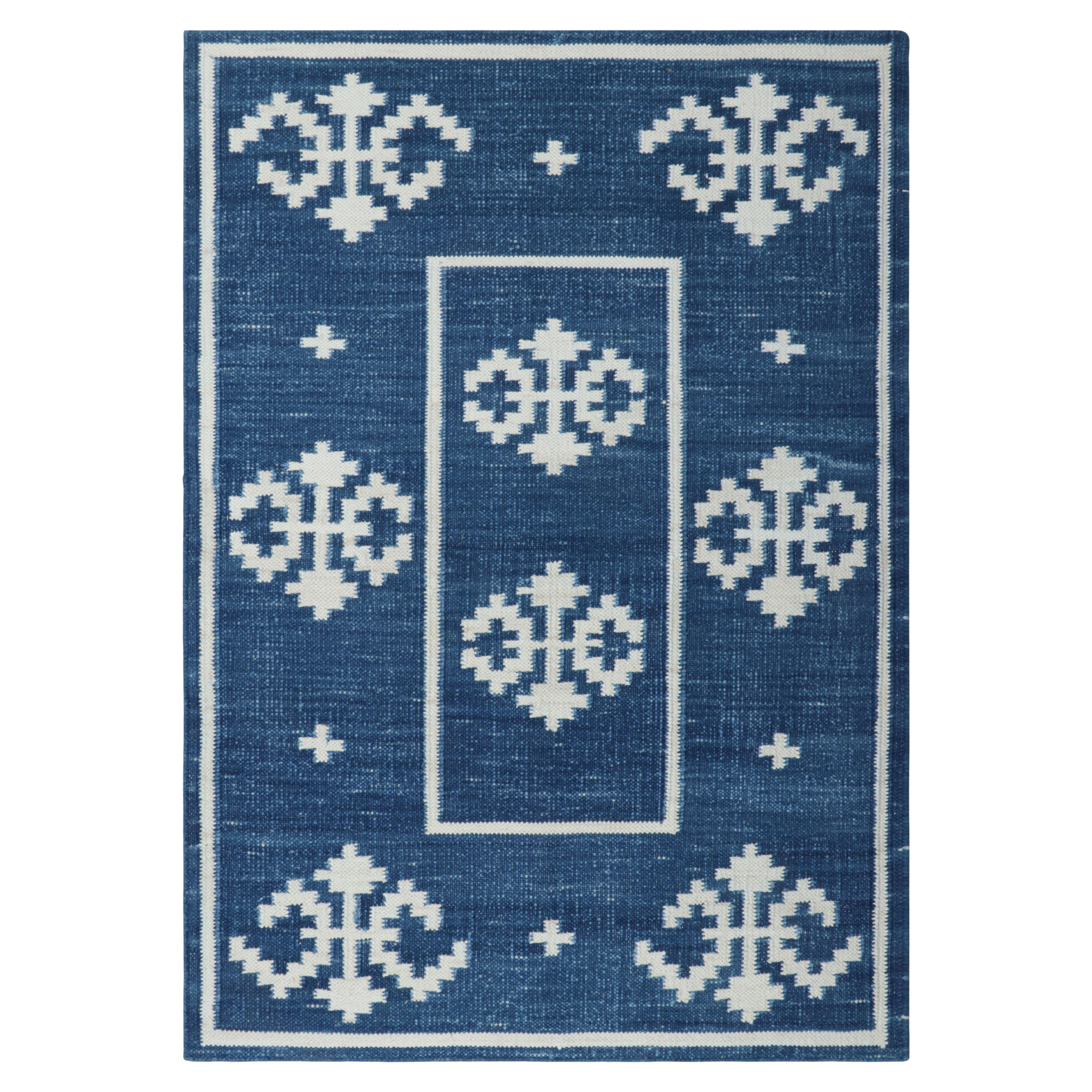 Rug & Kilim’s Contemporary Dhurrie Rug in Blue with White Geometric Medallions