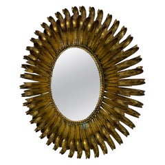 Espejo de pestañas oval dorado del siglo XX