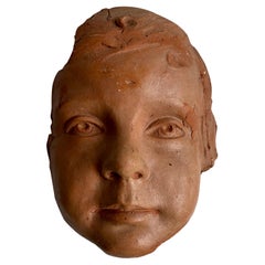 Scultura da parete con volto di bambino dell'artista Eugene Canneel, Belgio
