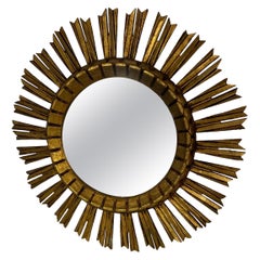 Miroir starburst en bois doré