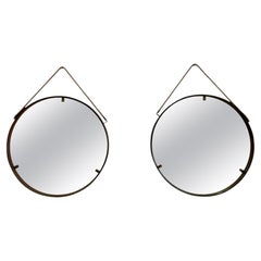 A Pair of Cognac coloured, Leather round Italian Mid 20th Century mirrors