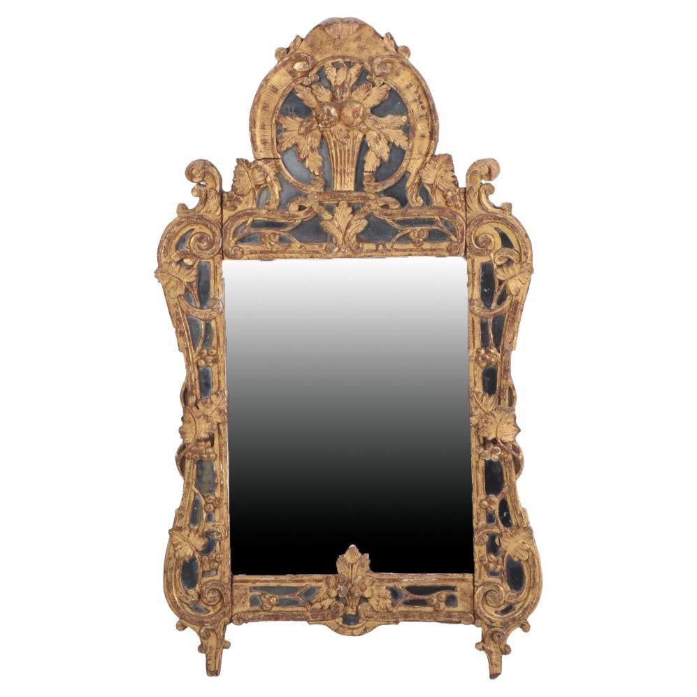A French giltwood mirror, 18th C.