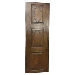 Antique Single-leaf interior door, with carved walnut panels, Italy