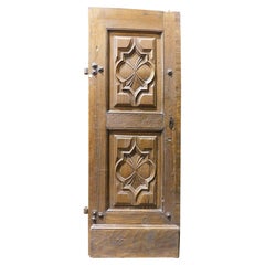Entrance door, single-leaf main door, in highly carved walnut, Italy