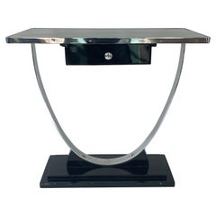 Mesa consola Art Decó cromada y lacada en negro atribuida a Donald Deskey, años 30