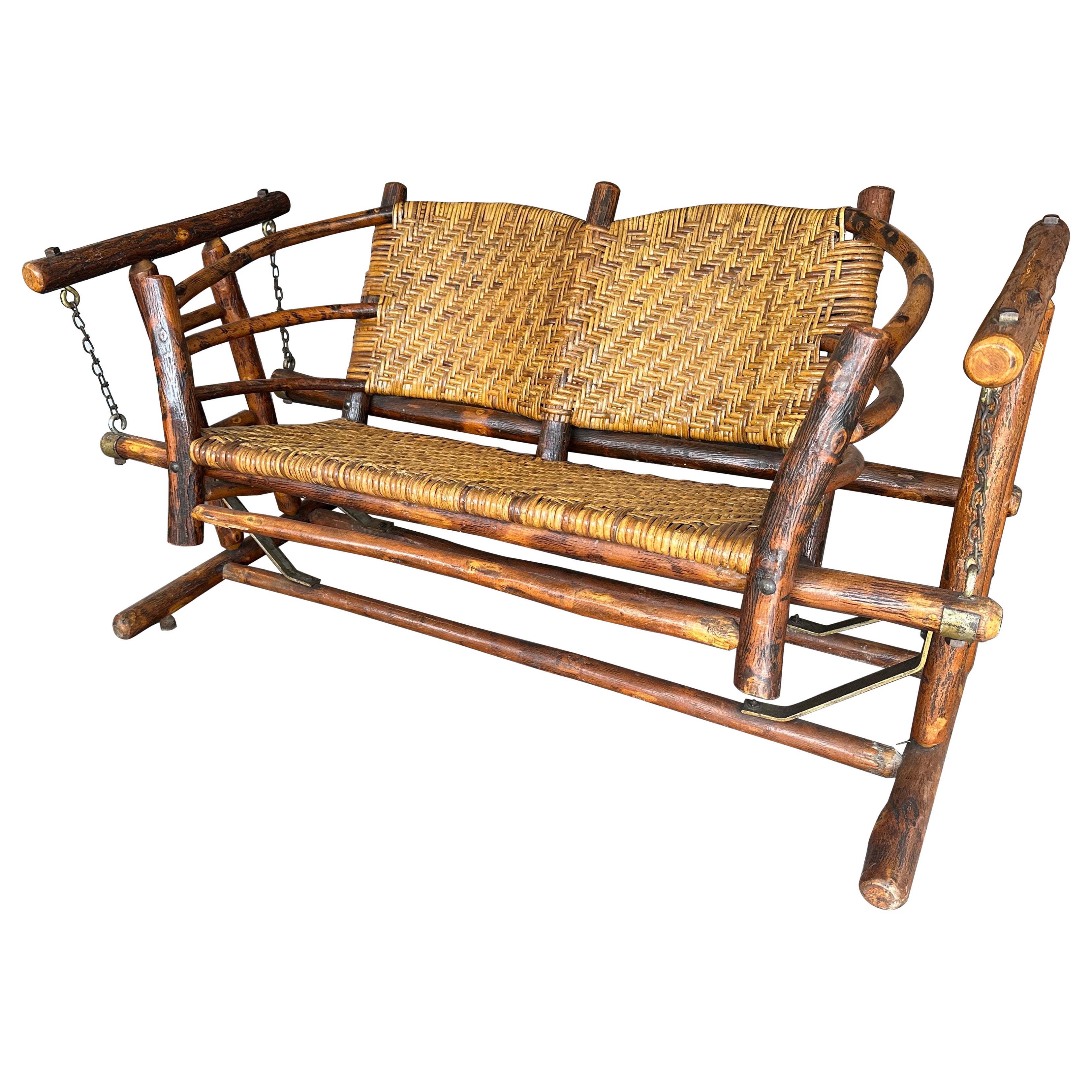 Old Hickory, two seat glider, rustic log frame with rettan