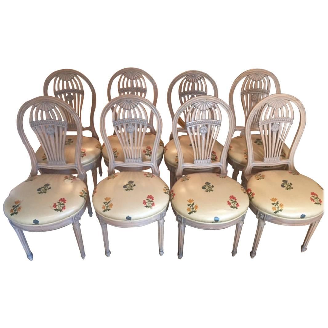 Set of ten Louis XVI style cream painted balloon back dining chairs,
French, circa 1950s.
The side chairs are 36