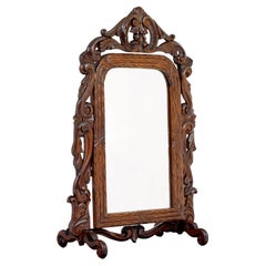 Late 19th century carved oak rococo revival vanity mirror