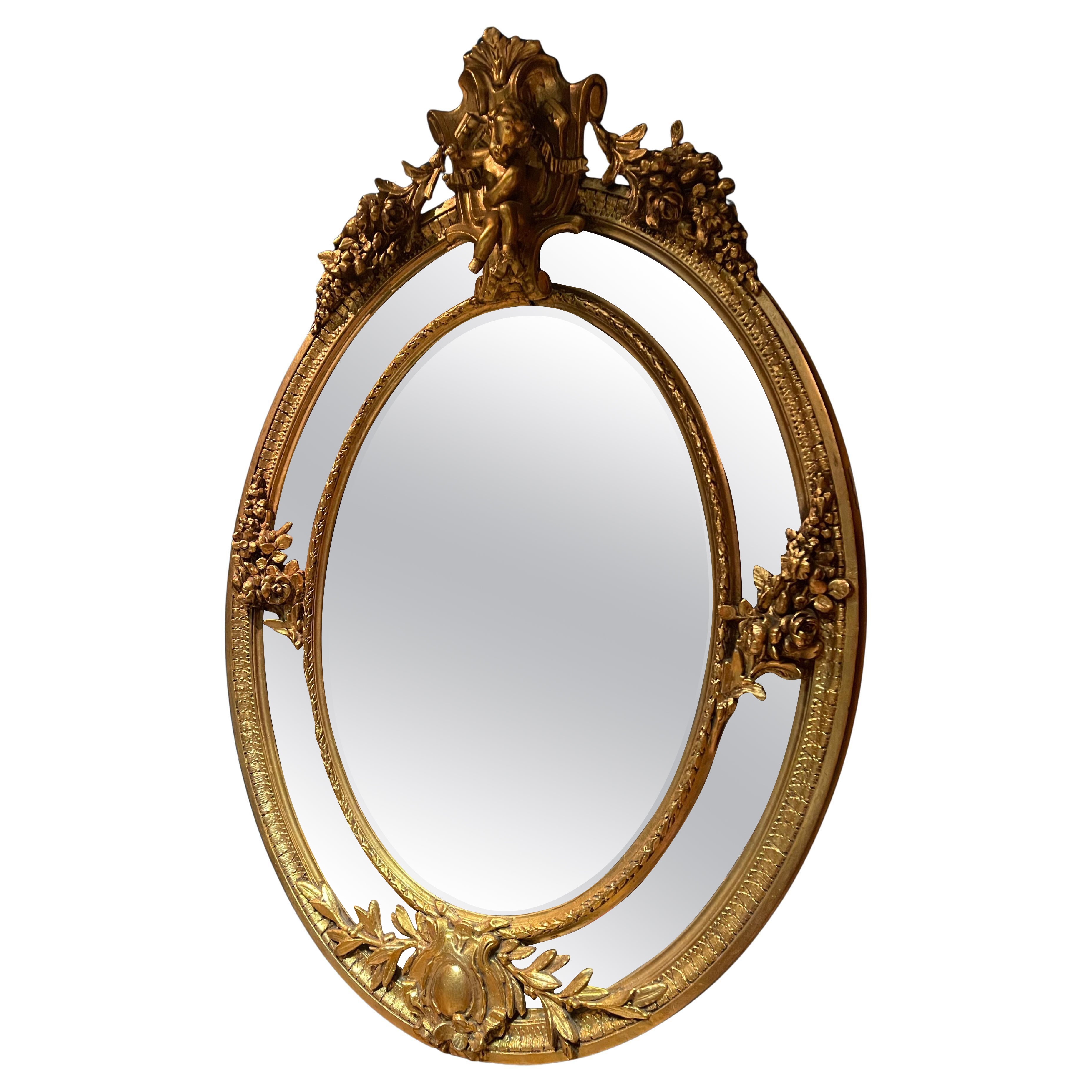 Antique French gold leaf gilded mirror from the 1800s