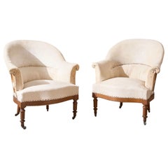 Pair of 19th century French tub chairs with show wood frame