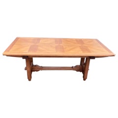 An oak Guillerme et Chambron dining table